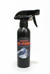 Black spray bottle with a label on a gray background